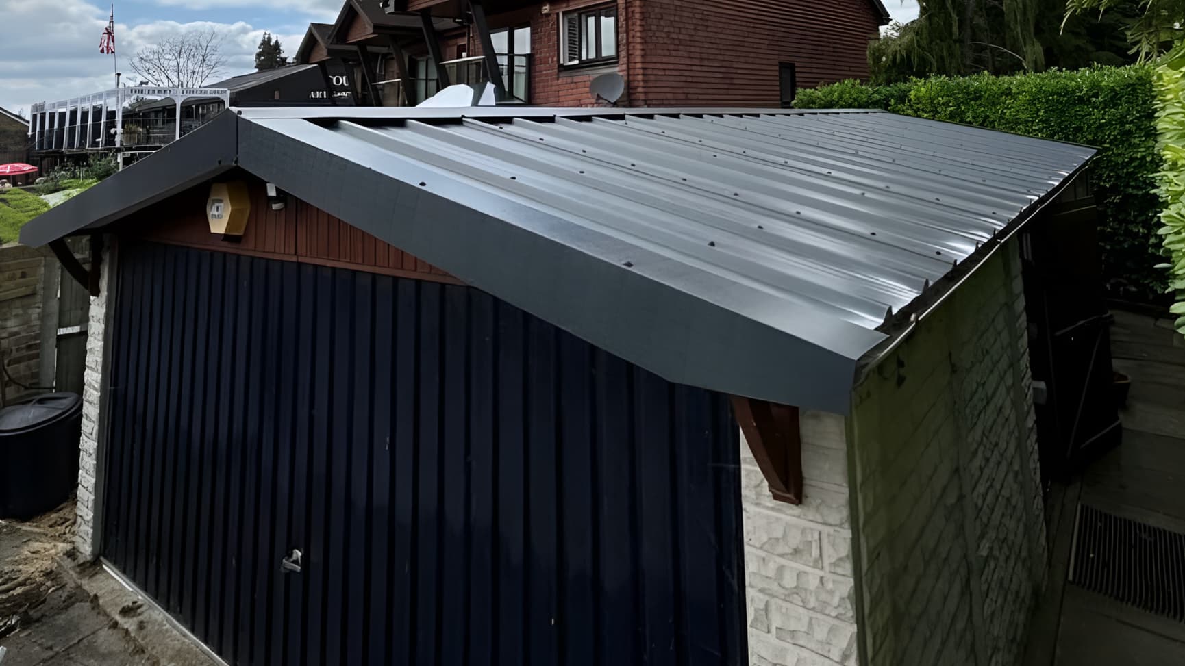 Completed asbestos garage roof removal in Epsom, Surrey, with new metal roof sheet replacement fitted by Surrey Environmental Services
